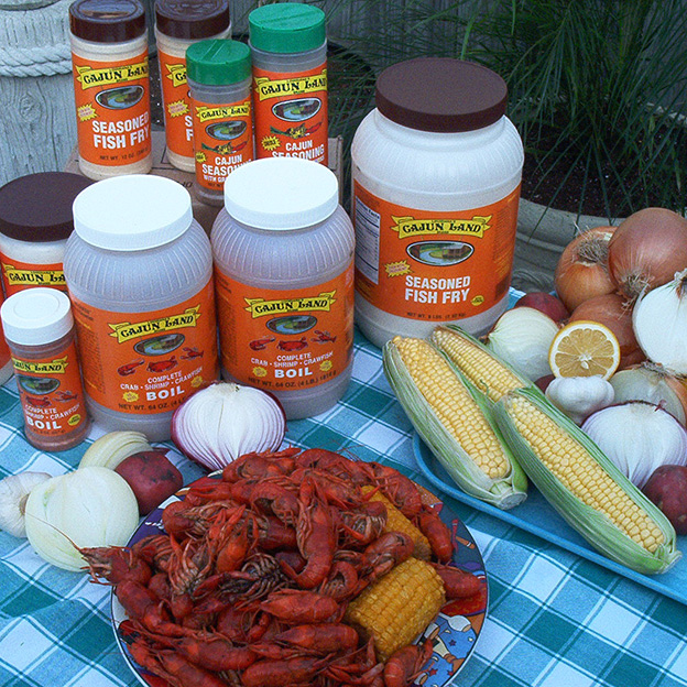 Picnic Table filled with Crawfish and Seasonings from Cajun Land Brand